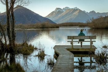 Sitting on a bench at Glenorchy Lagoon walking trail